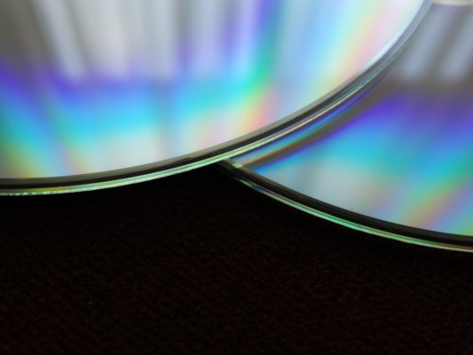 two dvds on a black background